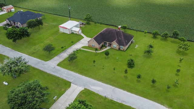 birds eye view of property with a rural view