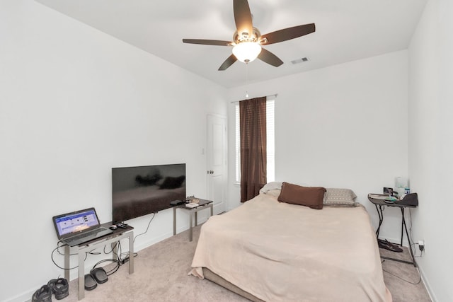 bedroom with light colored carpet and ceiling fan