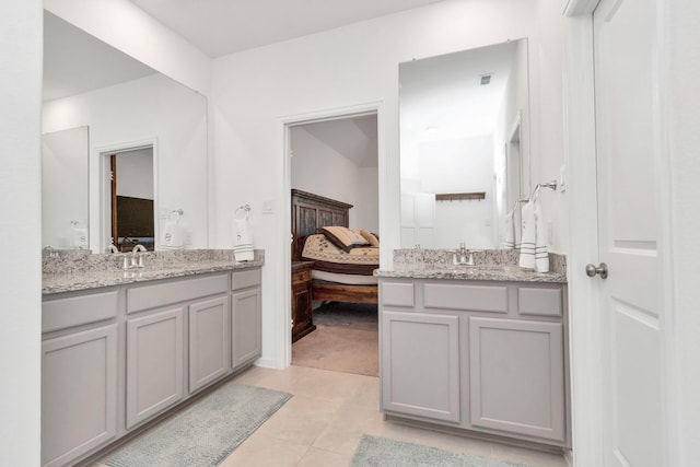 bathroom with tile patterned floors and vanity