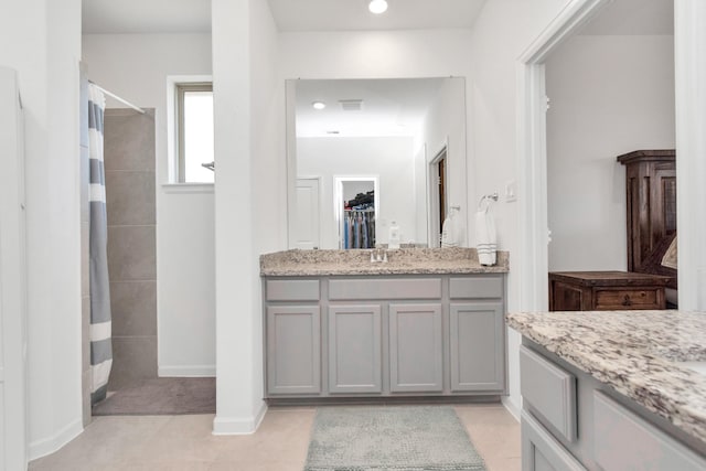 bathroom featuring vanity and curtained shower