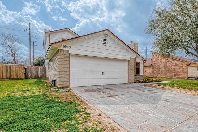 view of front facade featuring a garage and a front lawn