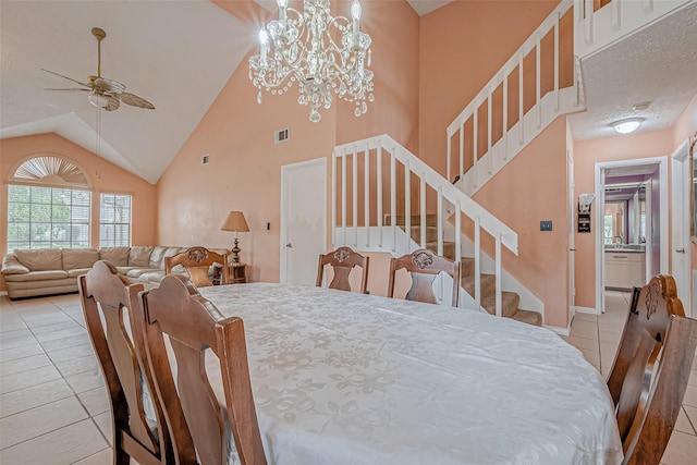 tiled dining area with high vaulted ceiling and ceiling fan