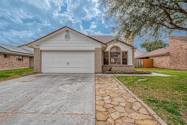 ranch-style home with a garage and a front yard