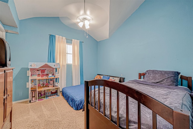 bedroom with vaulted ceiling, carpet floors, and ceiling fan