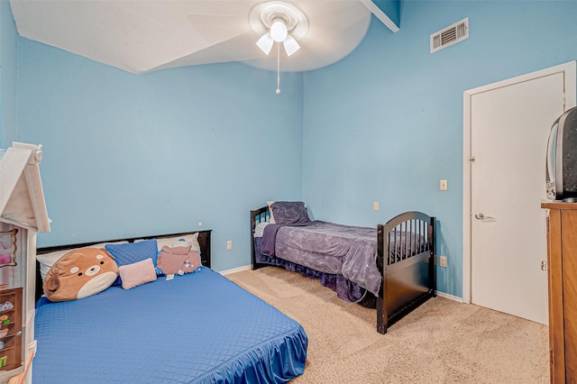 carpeted bedroom featuring ceiling fan and vaulted ceiling