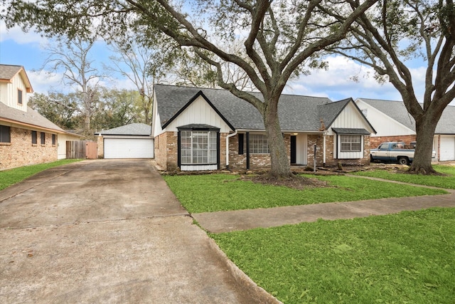 view of front of property with a garage and a front lawn