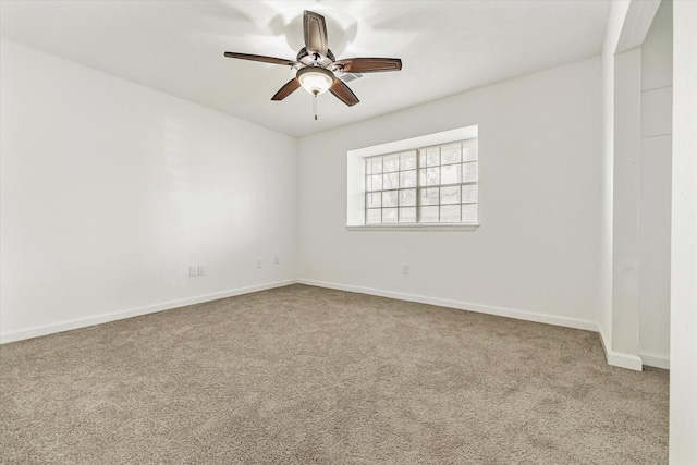 carpeted empty room with ceiling fan