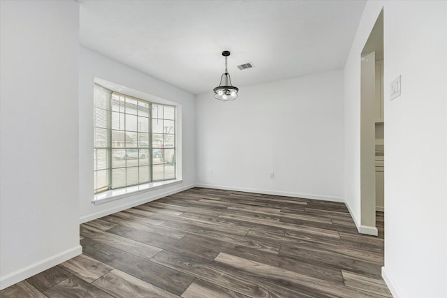 unfurnished dining area with dark hardwood / wood-style floors