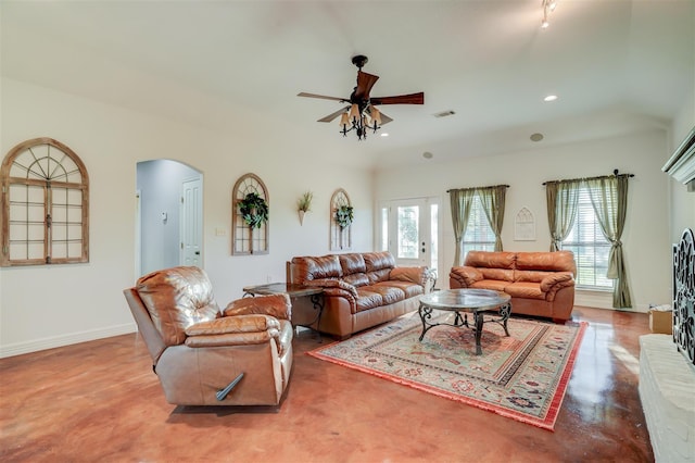 living area featuring recessed lighting, baseboards, visible vents, ceiling fan, and arched walkways