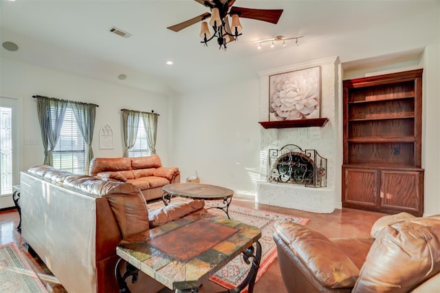 living room with a fireplace, ceiling fan, visible vents, and recessed lighting