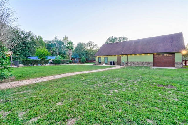 exterior space featuring fence and a garage