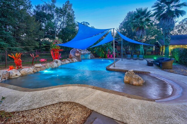 view of pool with a patio area, fence, and a fenced in pool