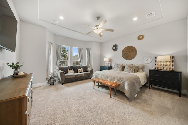 bedroom featuring ceiling fan and light carpet