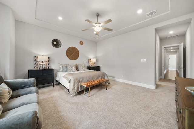 bedroom with light colored carpet and ceiling fan