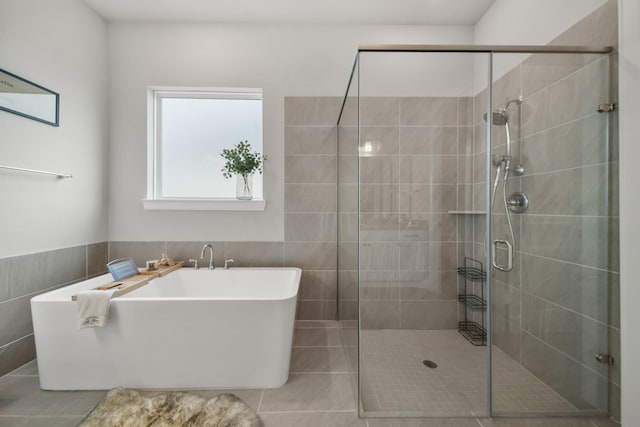 bathroom with plus walk in shower and tile walls