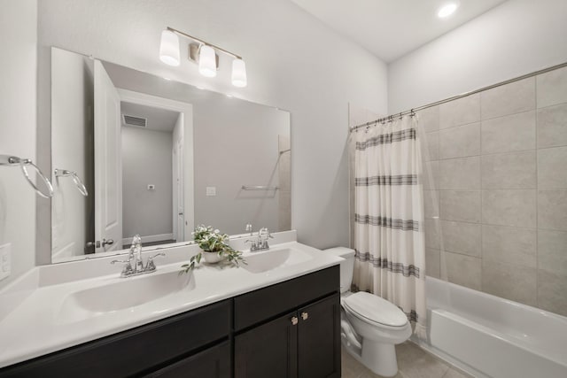 full bathroom with vanity, tile patterned flooring, toilet, and shower / bath combo with shower curtain