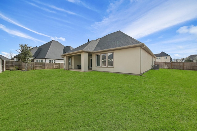 back of house featuring a patio, central AC, and a lawn