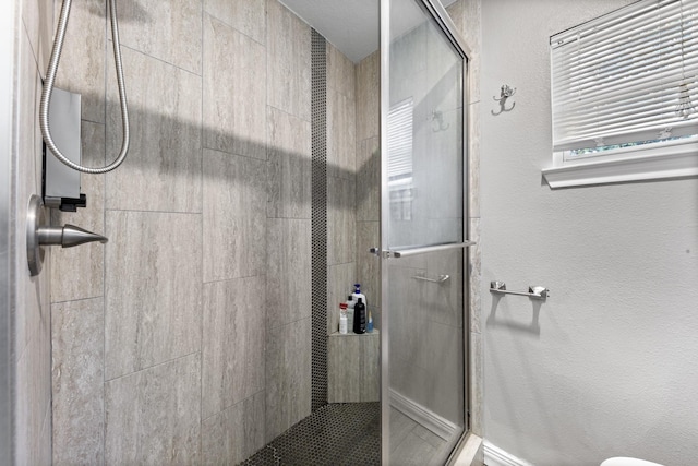 bathroom with an enclosed shower