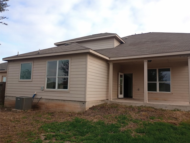 back of house with a patio area and central air condition unit