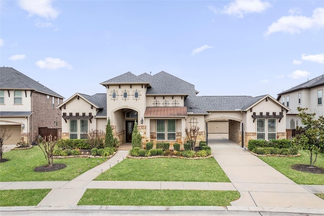 view of front of home featuring a garage and a front yard