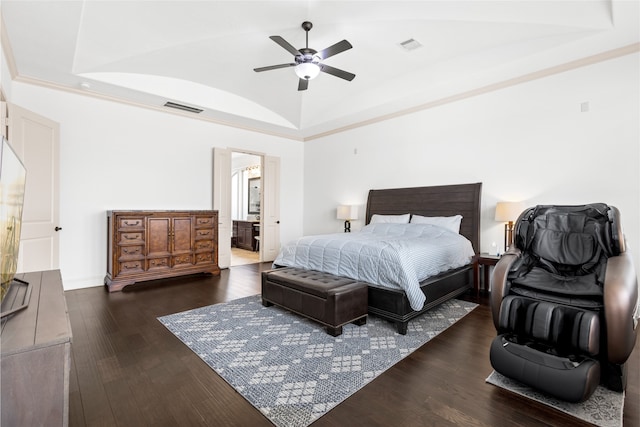 bedroom with dark hardwood / wood-style flooring, ensuite bath, vaulted ceiling, and ceiling fan