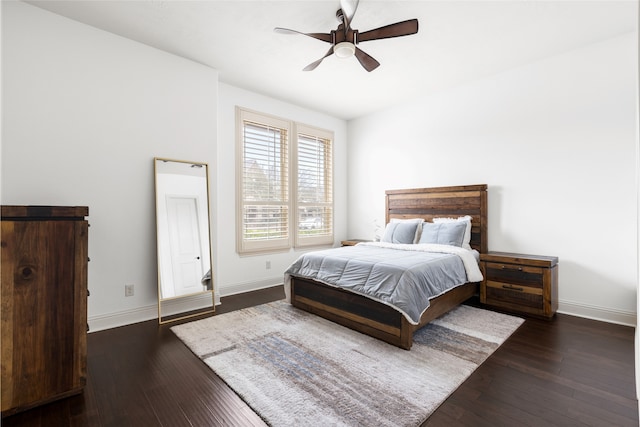 bedroom featuring ceiling fan and dark hardwood / wood-style floors