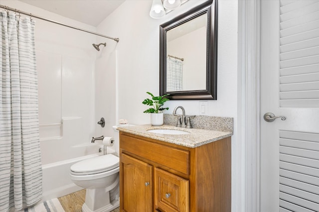 full bathroom featuring vanity, toilet, hardwood / wood-style floors, and shower / bath combo with shower curtain