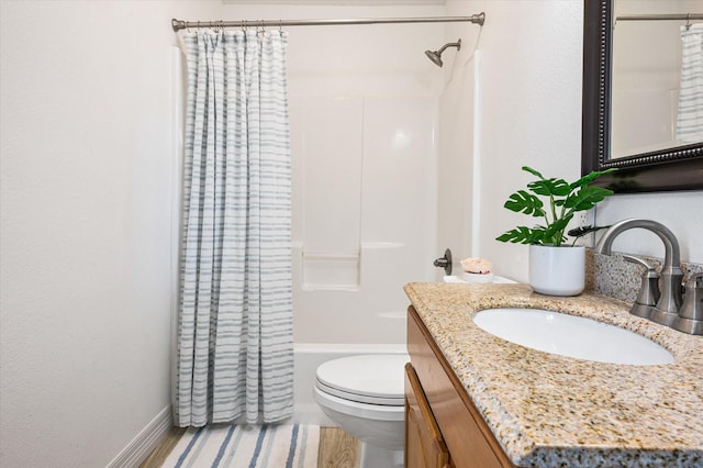 full bathroom featuring vanity, wood-type flooring, shower / bath combination with curtain, and toilet