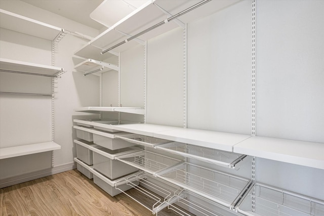 walk in closet featuring light wood-type flooring