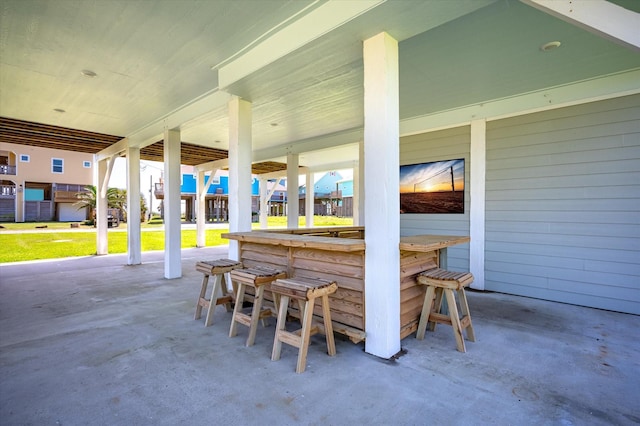 view of patio / terrace featuring an outdoor bar