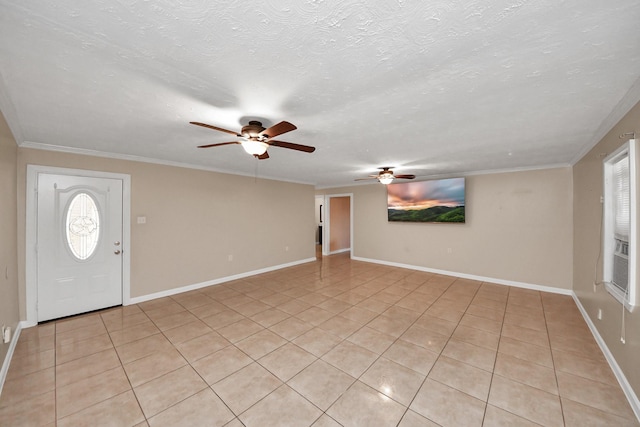 tiled entryway with crown molding, ceiling fan, and a textured ceiling