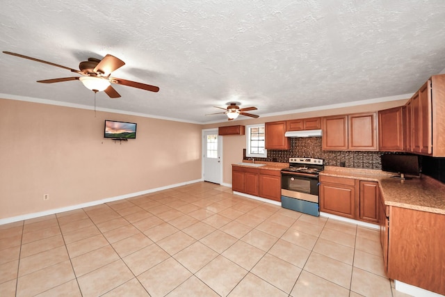 kitchen featuring crown molding, decorative backsplash, sink, and stainless steel electric range