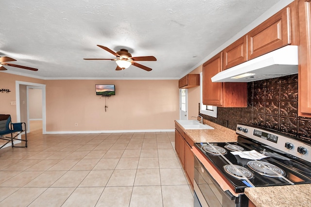 kitchen featuring light tile patterned flooring, sink, a textured ceiling, ornamental molding, and electric stove