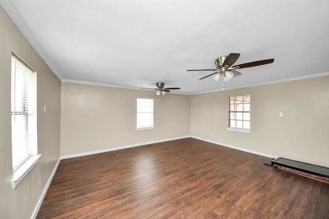 spare room with crown molding and dark hardwood / wood-style floors