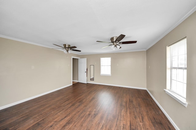 empty room with ornamental molding, dark wood-type flooring, and ceiling fan