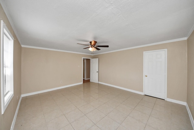 unfurnished room featuring ceiling fan, crown molding, light tile patterned floors, and a textured ceiling