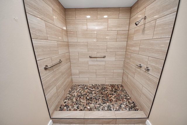 bathroom with a tile shower