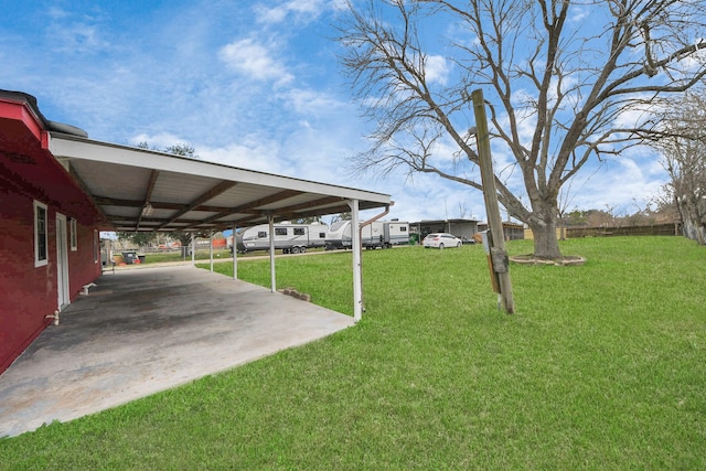 view of yard featuring a carport