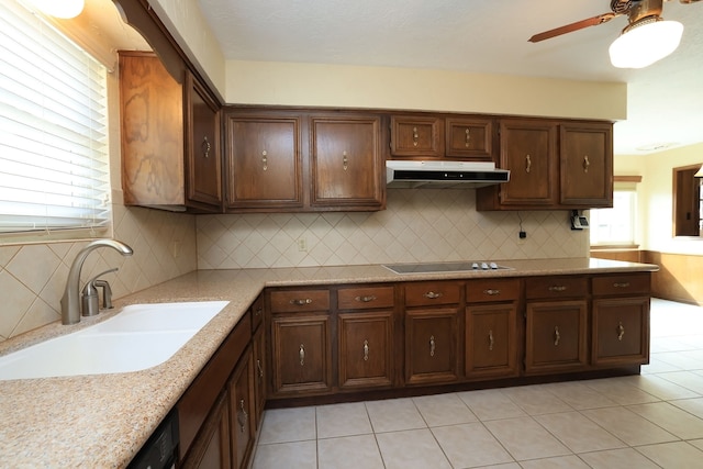 kitchen featuring sink, light tile patterned floors, ceiling fan, tasteful backsplash, and black electric stovetop