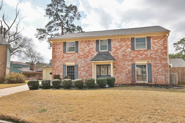 colonial home with a front yard