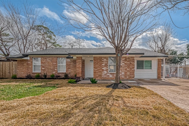 ranch-style home with a front lawn