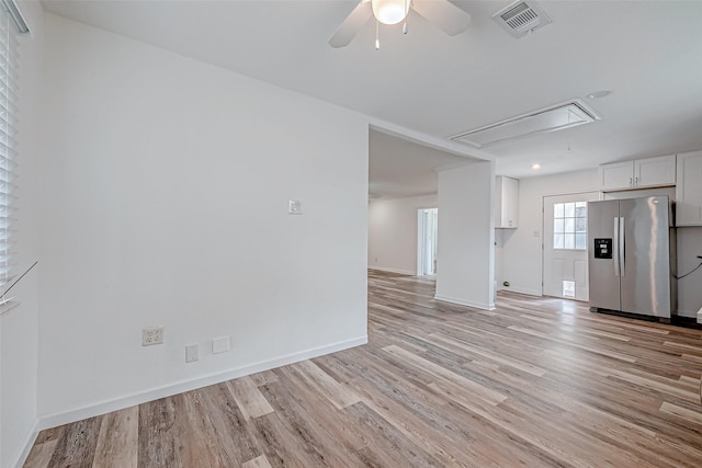 unfurnished living room with ceiling fan and light hardwood / wood-style floors