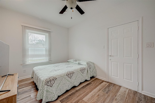 bedroom featuring ceiling fan and wood-type flooring