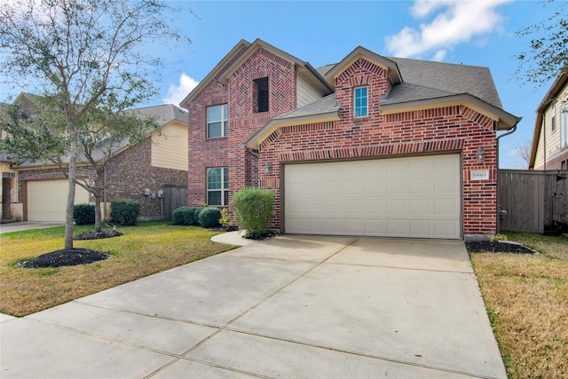 front facade with a garage and a front lawn