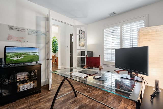 home office with dark wood-type flooring