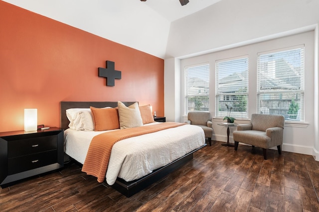 bedroom featuring ceiling fan, lofted ceiling, and dark hardwood / wood-style flooring