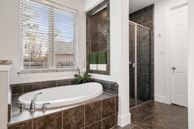 bathroom with independent shower and bath and tile patterned flooring