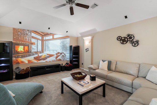 living room with lofted ceiling, light colored carpet, and ceiling fan