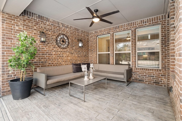 view of patio with an outdoor living space and ceiling fan