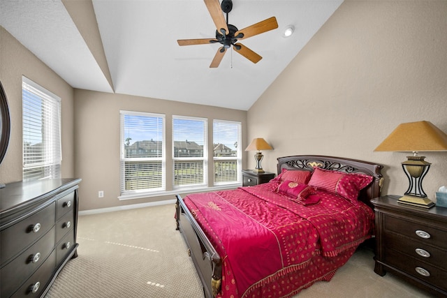 bedroom featuring lofted ceiling, light colored carpet, and ceiling fan